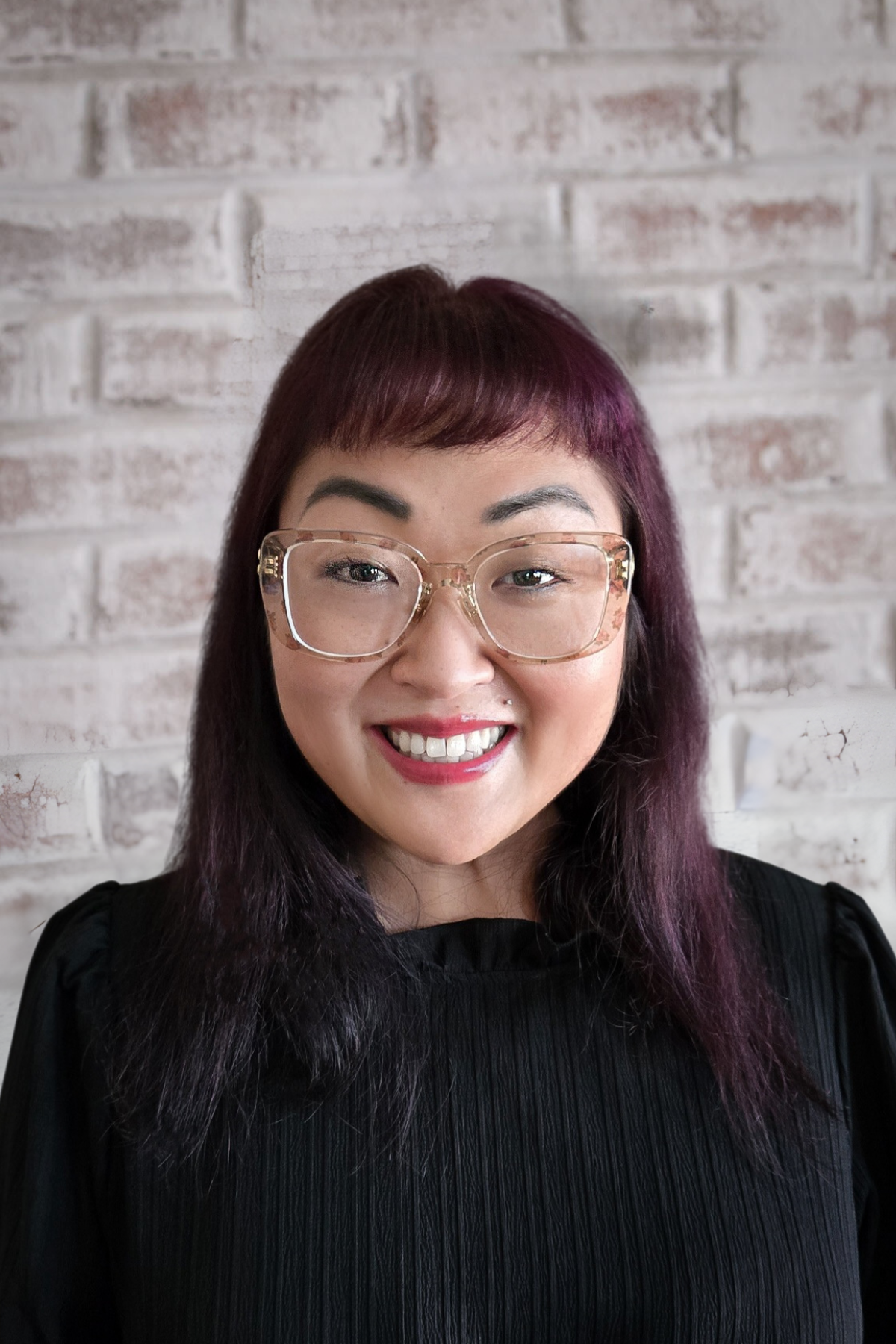 a woman smiling for the camera